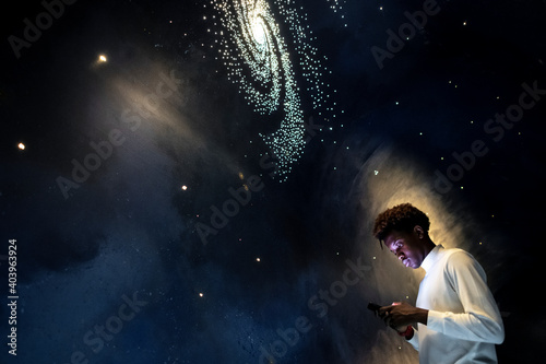 Man experiencing the universe at a planetarium photo