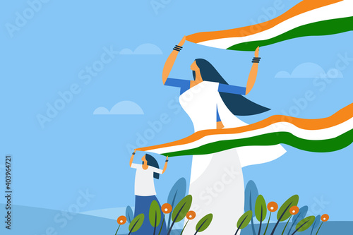 A mother and daughter holding the Indian tricolour flag flying in the wind
