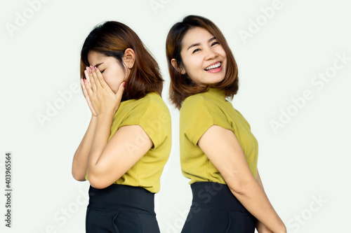 Asian woman having problem with two personality or bipolar with difference face  moody, sad and happy photo