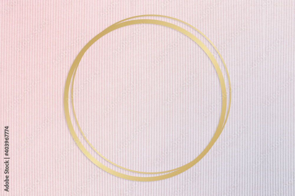 Gold round frame on a pinkish blue fabric background Gold round frame on a pinkish blue fabric background