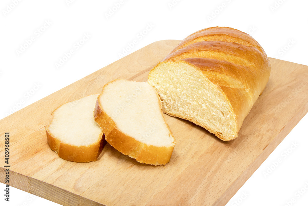 A loaf of white bread with two slices cut off lies on a wooden Board. Isolation.