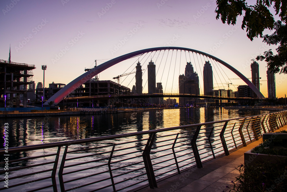Obraz premium Dubai, UAE - 01.08.2021 Bridge over a Dubai Water canal known as Tolerance bridge. Outdoors