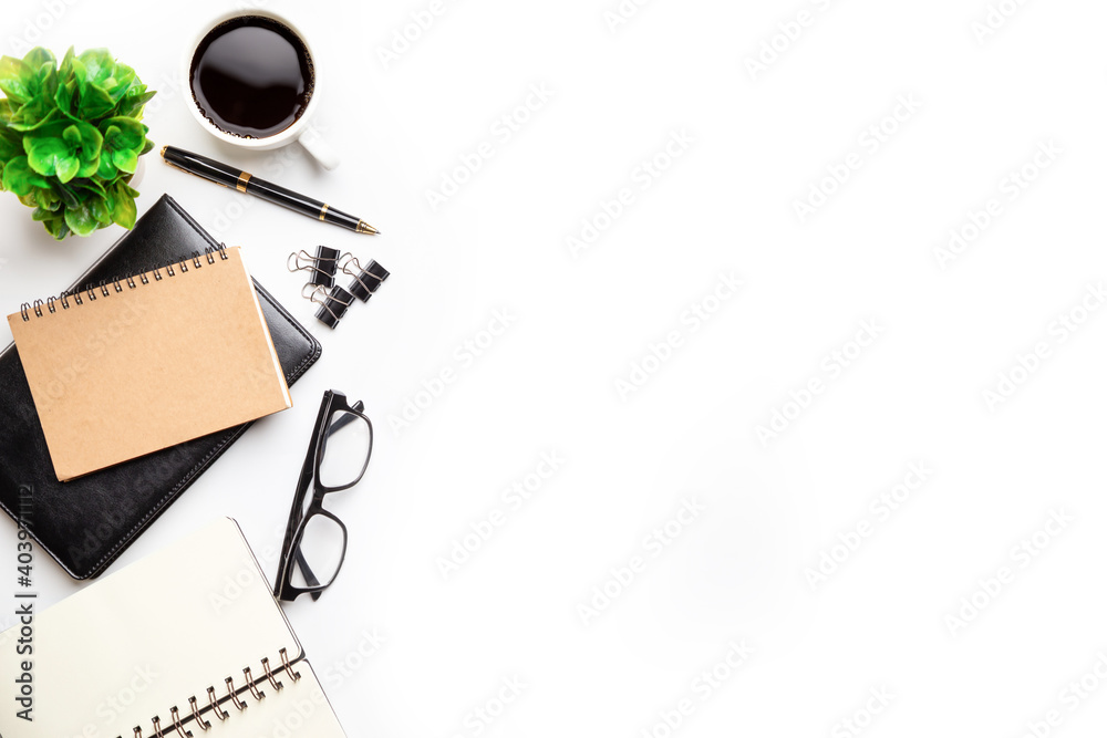 Flat lay, top view office table desk. Workspace with, laptop,office supplies, pencil, green leaf, and coffee cup on white background. Flat lay, top view office table desk. Workspace with, laptop,office supplies, pencil, green leaf, and coffee cup on white background.