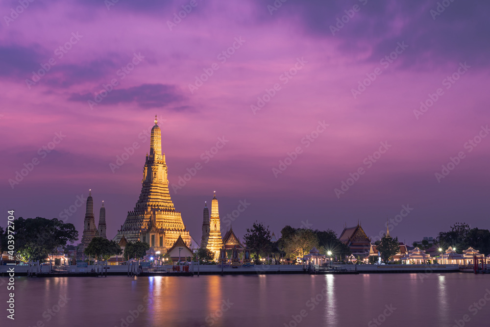 Wat Arun temple of dawn or wat chaeng  on the west (Thonburi) bank of the Chao Phraya river at twilight time in Bangkok,Thailand.
