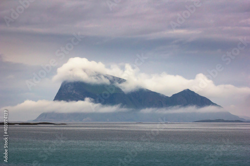 The famous Haja island off the coast of northern Norway, surrounded by clouds