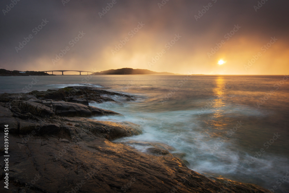 Storm and sun over little islands in northern Norway
