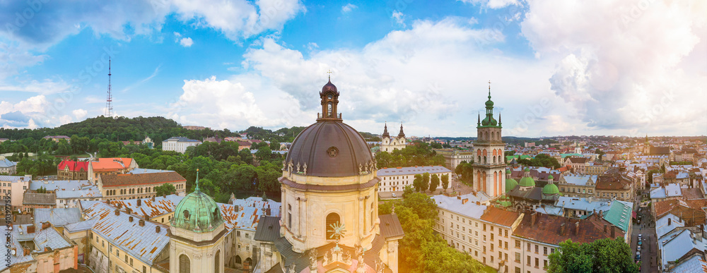 Obraz premium Aerial view on Market square, Dormition, Dominican and Carmelite Church in Lviv, Ukraine from drone