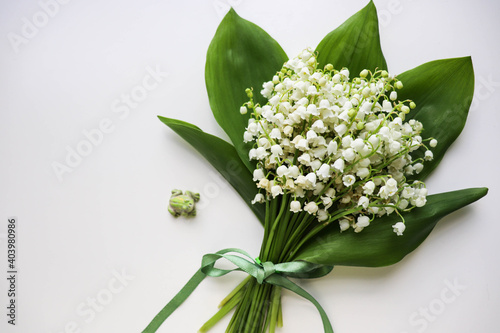mockup greeting card. spring composition. bouquet of lilies of the valley and space for text. congratulation. invitation