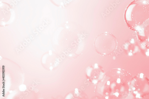 Blur transparent soap bubbles float on pink background. Beautiful pink valentine' day concept.