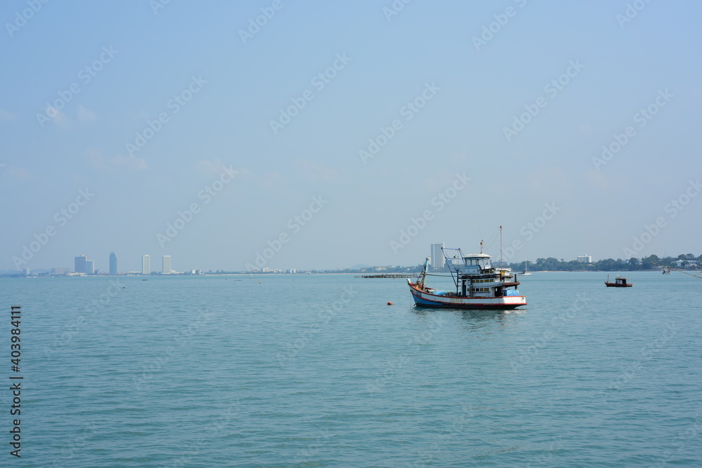 View of the fishing port overlooking the boat and Pattaya city. Which is a large city close to local fishing sources in Thailand	