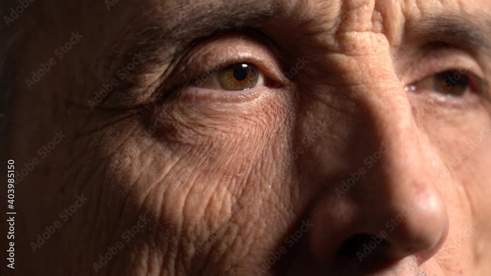 Close-up. an elderly man looks away from the camera. side view. old age concept. Close-up. an elderly man looks away from the camera. side view. old age concept.