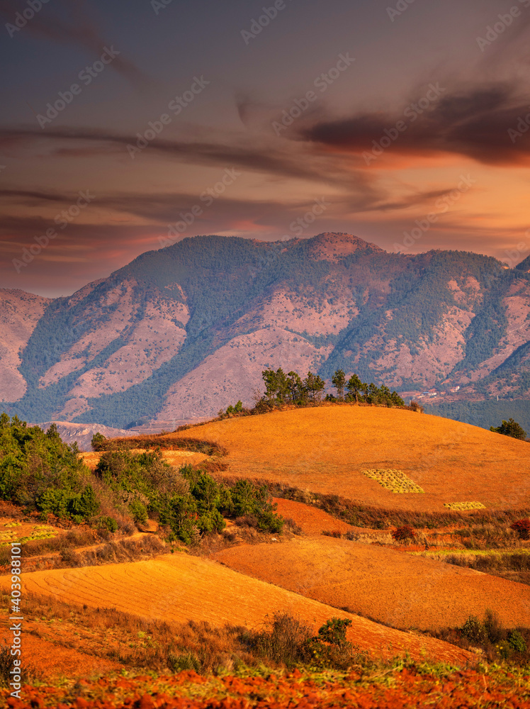 village on hills in sunset