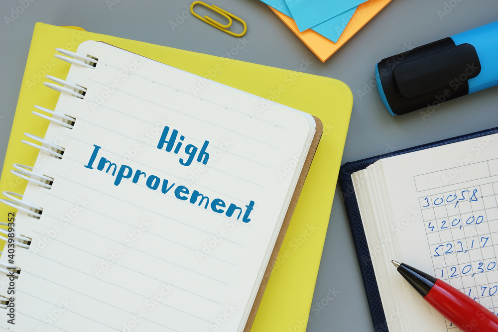 Financial concept meaning High Improvement with phrase on the sheet. Financial concept meaning High Improvement with phrase on the sheet.