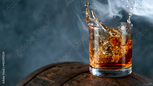 Ice Cube falling into Glass...