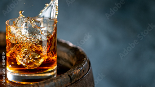 Ice Cube falling into Glass...