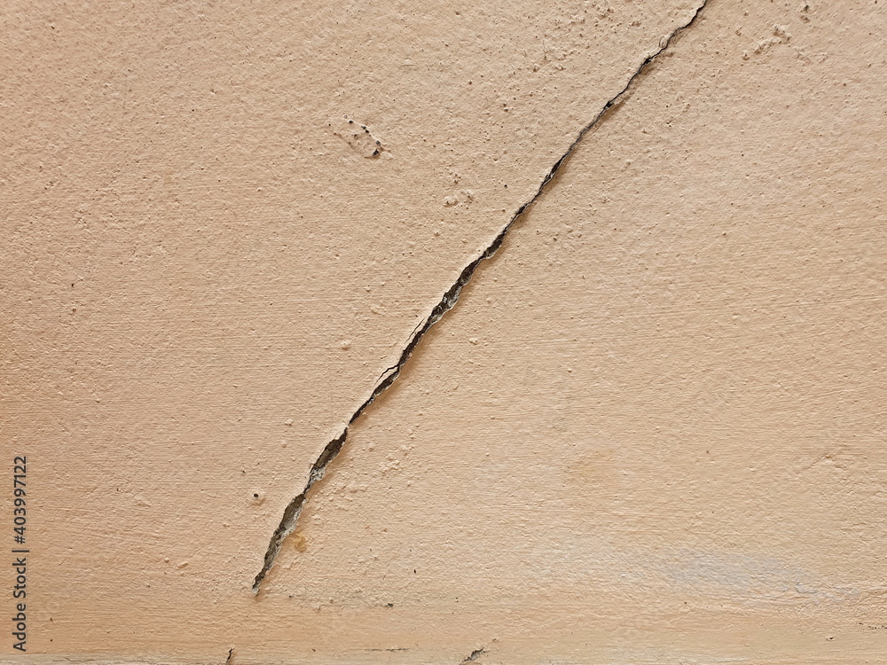 The crack on the cement wall is painted in light orange. This fissure can be caused by inefficient construction or water seeping into the cement wall. Causing damage to the structure of the house
The crack on the cement wall is painted in light orange. This fissure can be caused by inefficient construction or water seeping into the cement wall. Causing damage to the structure of the house
