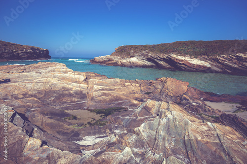 Seascape. Rocky sea coast on a sunny day. Praia de Esteiro, Ribadeo, Lugo, Spain, Europe photo