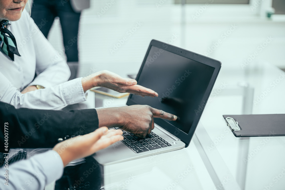 close up. a group of employees discussing online information