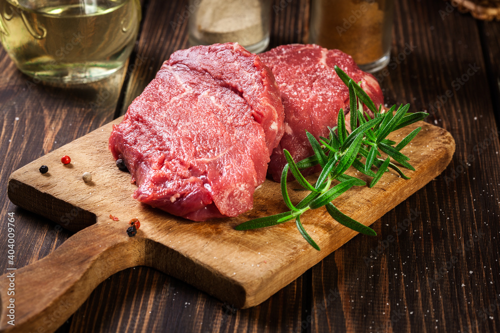 Fresh raw beef steak sirloin with rosemary Fresh raw beef steak sirloin with rosemary