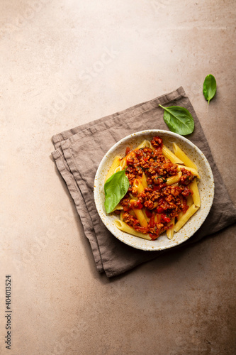 Overhead view of penne pasta with bolognese