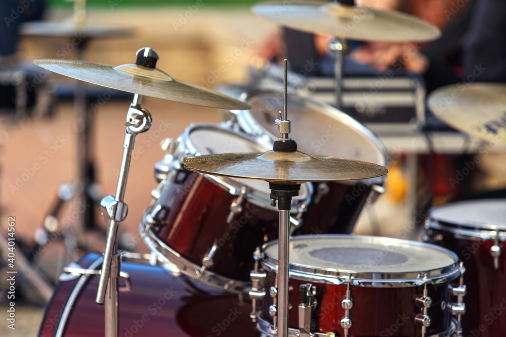 Obraz premium Drum set. Percussion musical instruments on a city street. Close-up