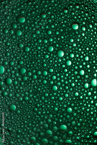 Soap foam shot close up on a green background