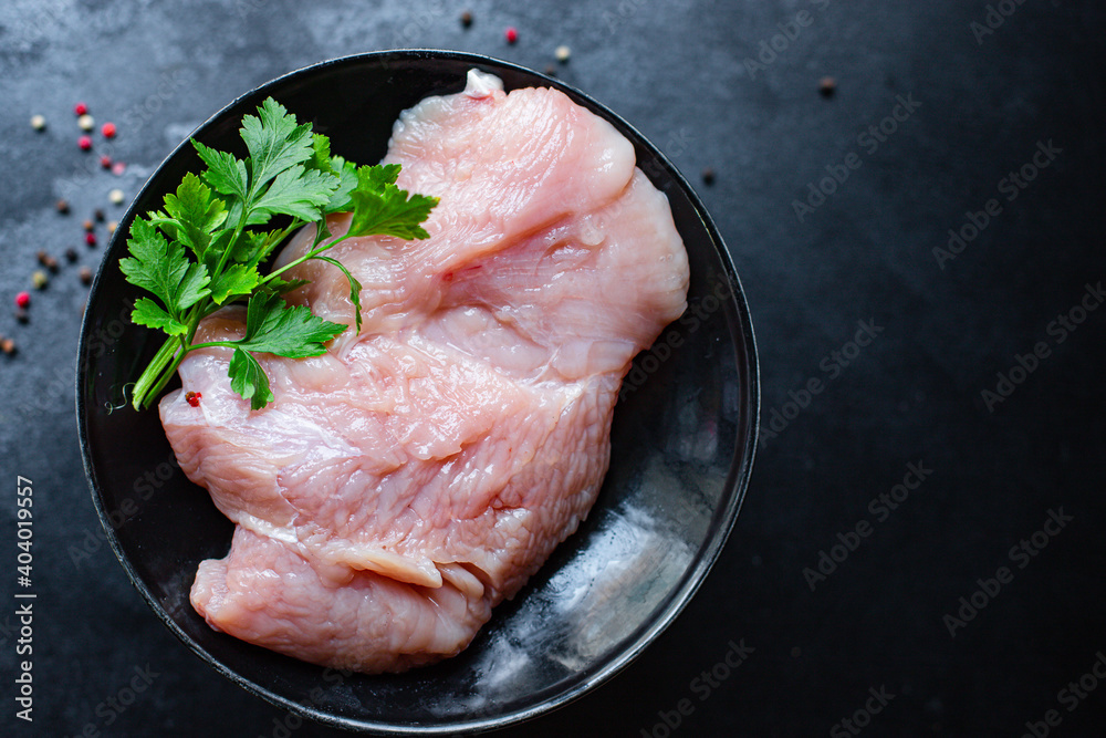 raw turkey or chicken fillet fresh meat healthy meal snack top view copy space for text food background rustic image keto or paleo diet raw turkey or chicken fillet fresh meat healthy meal snack top view copy space for text food background rustic image keto or paleo diet
