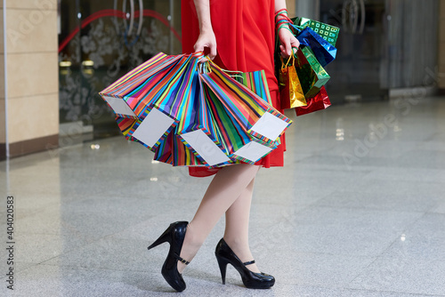 A girl with paper gift shopping bags