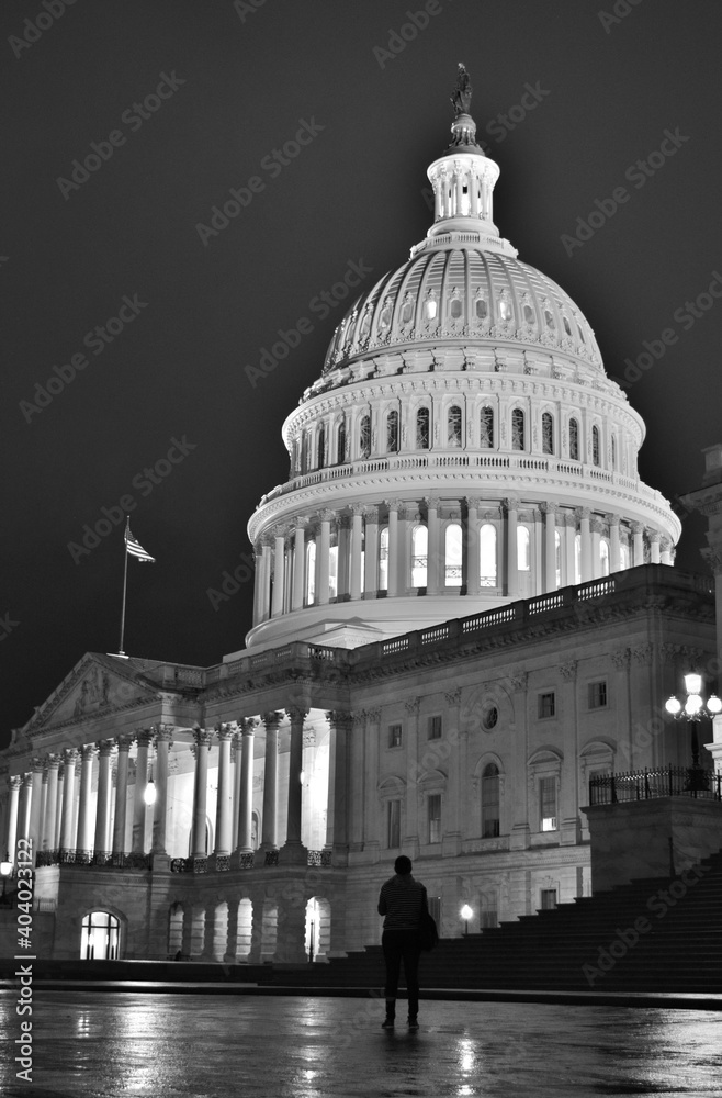 Silhouette of Person Standing in front of the US Capitol Building with the Iconic Dome in the Background at Night (Black and White) - Washington D.C. , USA 