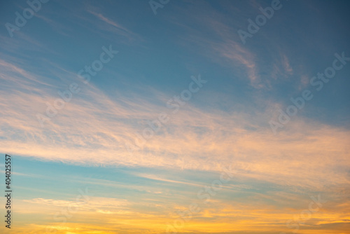 Colorful sky sunrise or sunset with cloud beautiful, Yellow and blue sky background. © Bigc Studio