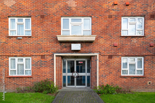 The entrance of a typical British brick block of flats