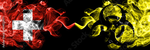 Switzerland, Swiss vs Biohazard, Virus, Covid smoky mystic flags placed side by side. Thick colored silky abstract smoke flags.