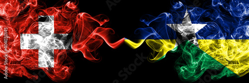 Switzerland, Swiss vs Brazil, Brazilian, Rondonia  smoky mystic flags placed side by side. Thick colored silky abstract smoke flags. photo