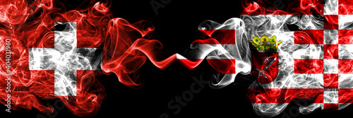Switzerland, Swiss vs Germany, German, Bremen smoky mystic flags placed side by side. Thick colored silky abstract smoke flags.
