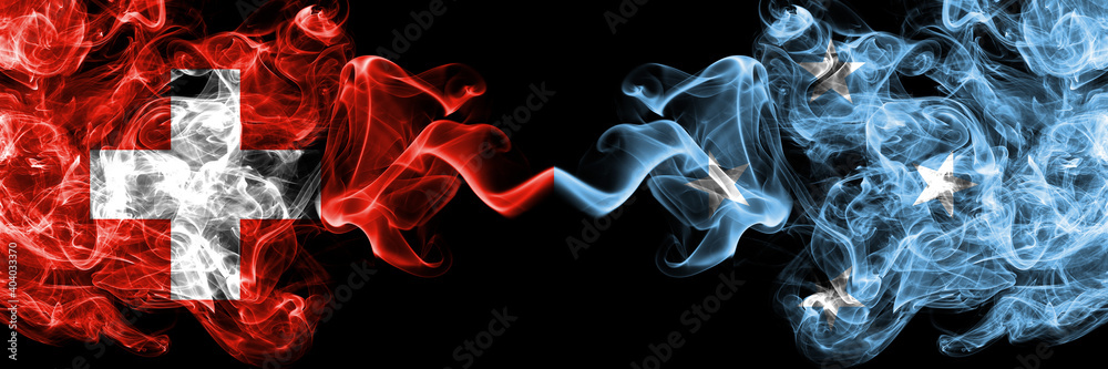 Switzerland, Swiss vs Micronesia smoky mystic flags placed side by side. Thick colored silky abstract smoke flags. Switzerland, Swiss vs Micronesia smoky mystic flags placed side by side. Thick colored silky abstract smoke flags.
