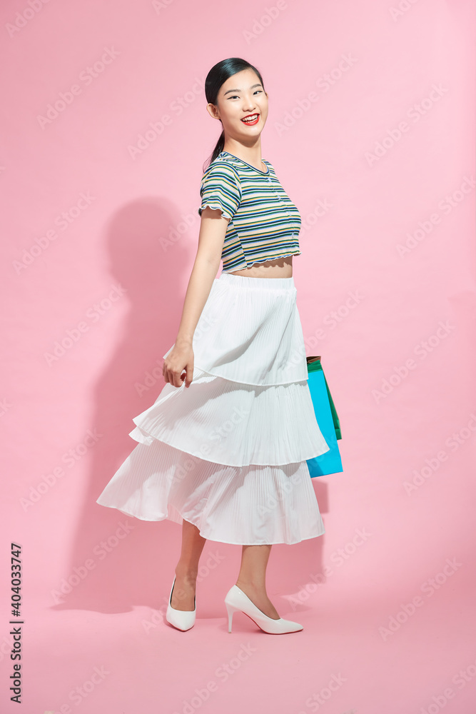 Nice-looking woman smiling and happy shopping bags. Nice-looking woman smiling and happy shopping bags.