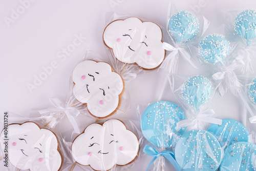 gingerbread white clouds and blue stars in transparent bags. sweet table for children's birthday