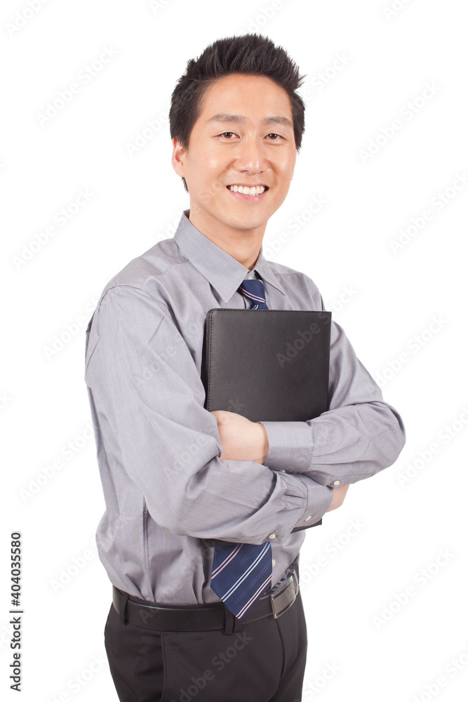 Business man holding notebook posing in studio Business man holding notebook posing in studio
