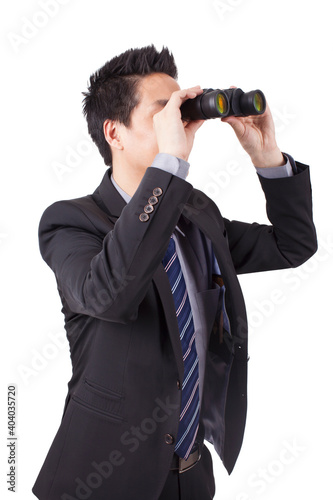 A young Business Man Looking Through Binoculars 