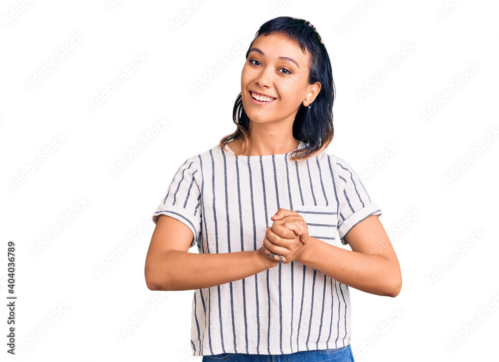 Young woman wearing casual clothes with hands together and crossed fingers smiling relaxed and cheerful. success and optimistic Young woman wearing casual clothes with hands together and crossed fingers smiling relaxed and cheerful. success and optimistic