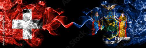 Switzerland, Swiss vs United States of America, America, US, USA, American, New York smoky mystic flags placed side by side. Thick colored silky abstract smoke flags.