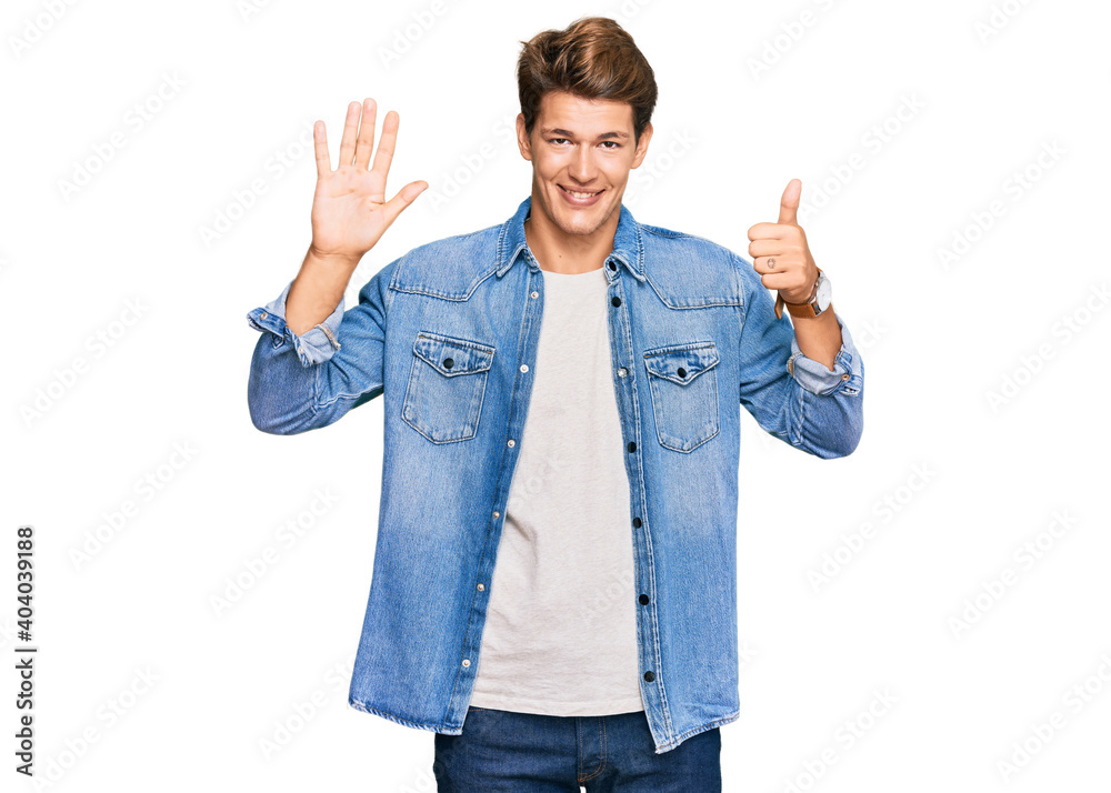 Handsome caucasian man wearing casual denim jacket showing and pointing up with fingers number six while smiling confident and happy. Handsome caucasian man wearing casual denim jacket showing and pointing up with fingers number six while smiling confident and happy.