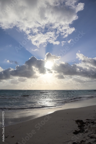 Rays of the sun through the clouds on the beach in the afternoon 