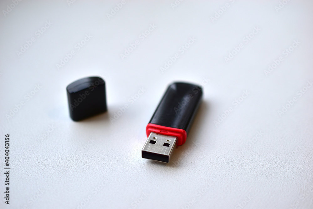 Black flash drive on a white background Black flash drive on a white background
