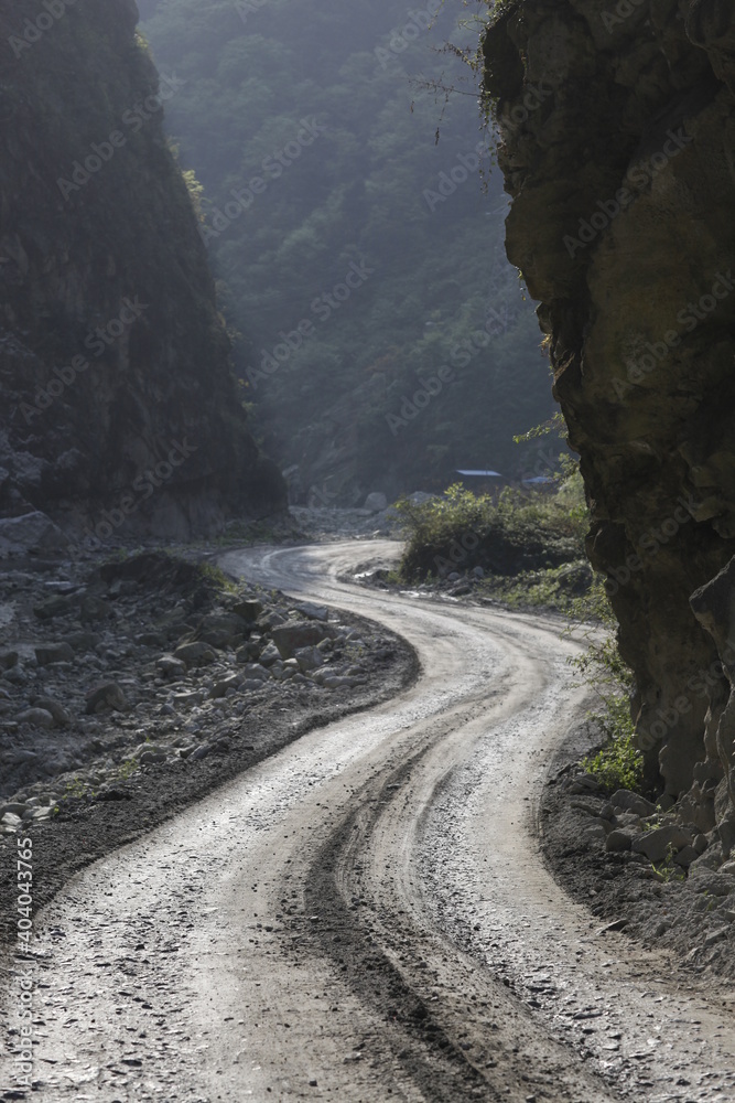A rural Muddy road in the mountains 