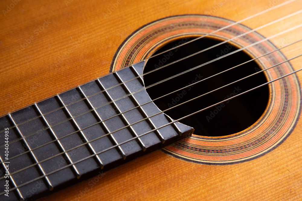 Closeup of the body of an acoustic guitar Closeup of the body of an acoustic guitar
