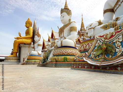 Big Buddha Statue and pagoda. Wat Nong Pong Nok. Blue sky. photo