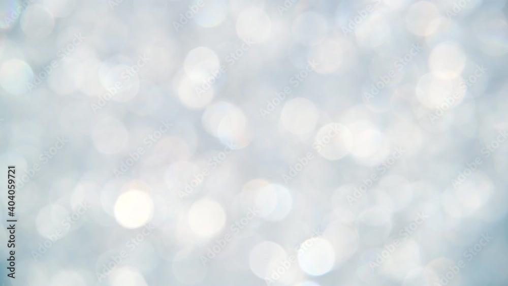Abstract background of silver bokeh spinning Abstract background of silver bokeh spinning