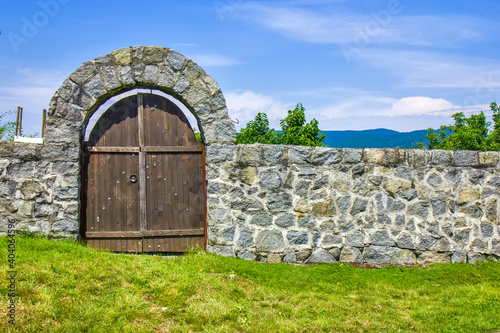 Old medieval fence around monastery Gradac, Serbia photo