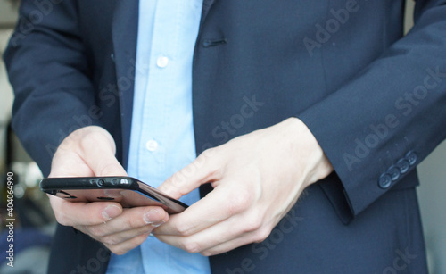 Men holds a smartphone in the hands